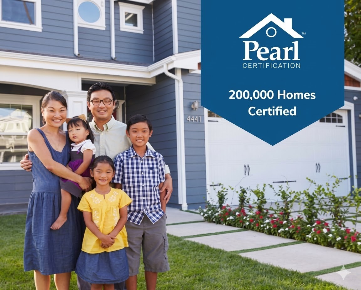 Family standing in front of a house with a Pearl Certification banner