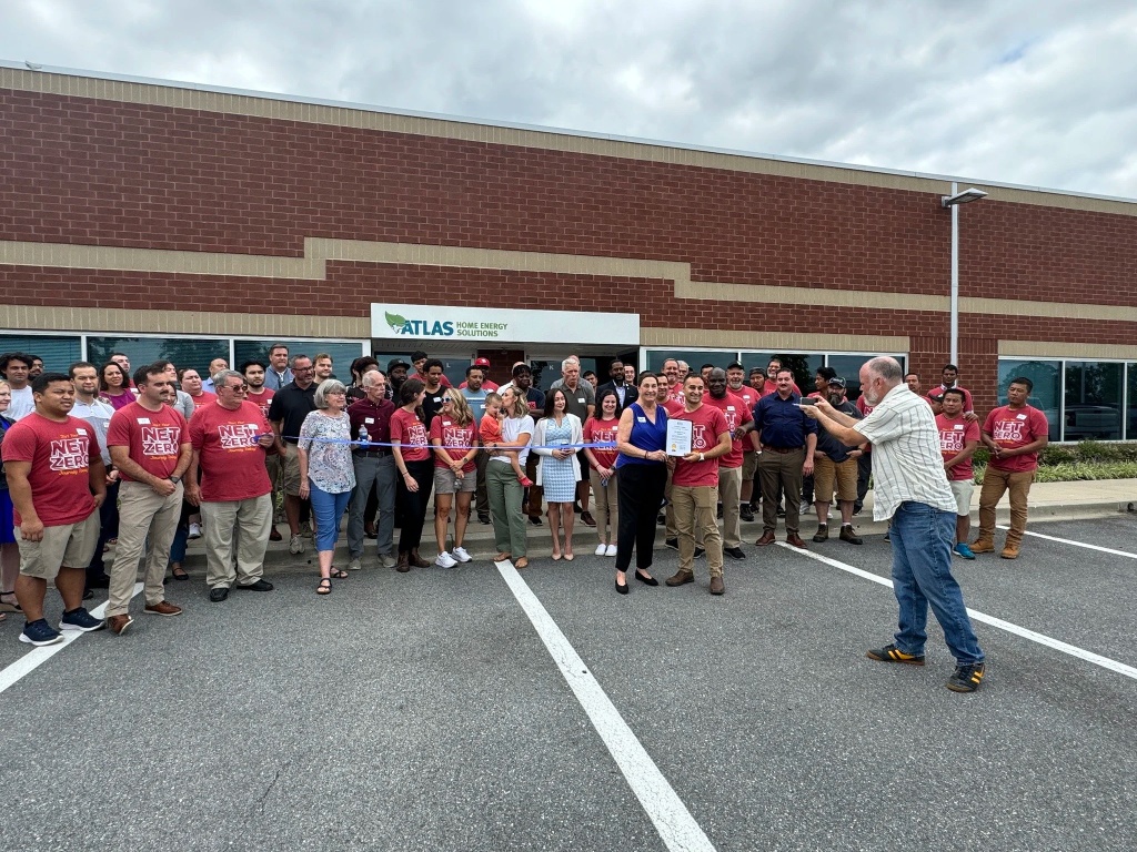 A company team picture of an event promoting Net Zero energy