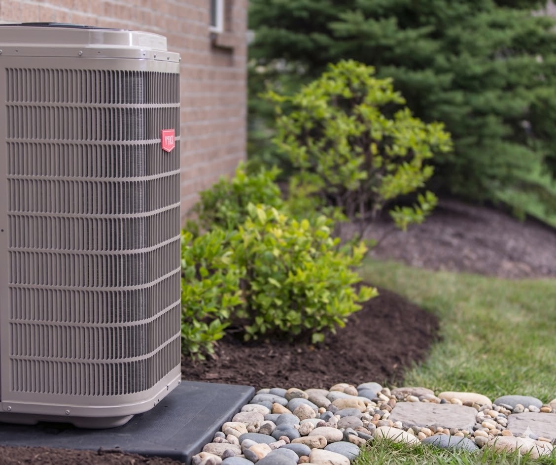 Heat pump outdoors by house